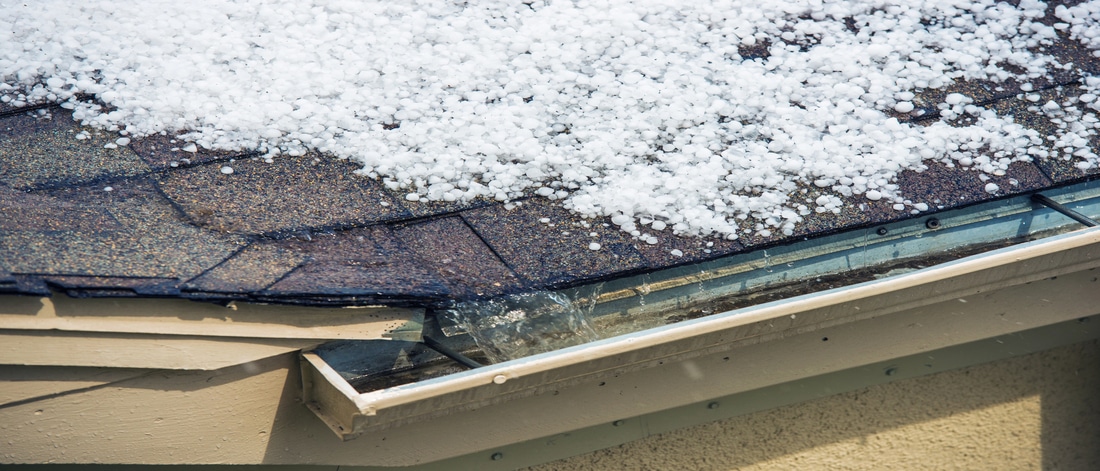 small melting hail on the roof. severe weather concept.
