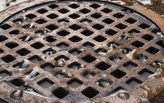 water droplets, highlighting how sewer water can affect your health and the importance of proper cleanup and safety measures.