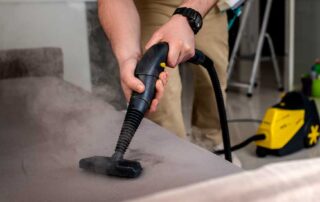 Cleaning sofa with steam cleaner machine